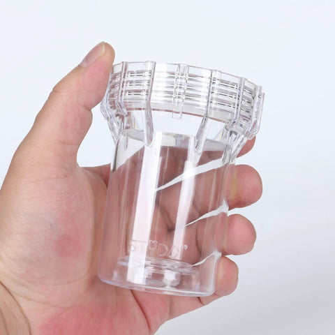 Person holding clear plastic component of Inline Garden Hose Water Filter For Well Water With 100 Mesh Screen Sediment Filter Attachment