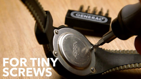 Cordless Electric Screwdriver With Quick Change Chuck And Six Bits used for watch repair, showing precision fastening capabilities.
