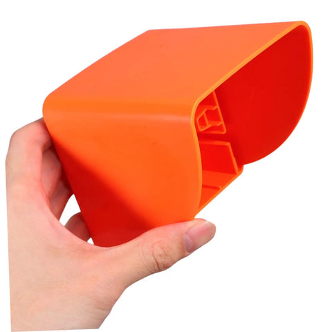 Badass Heavy Duty Ev Charger Cover And Weatherproof Outlet Protector for 86 Type Electrical Jack Plates held in hand, vibrant orange.