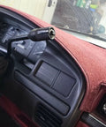 Instrument dash panel bezel installed in a red Ford interior; front gauge cluster view.
