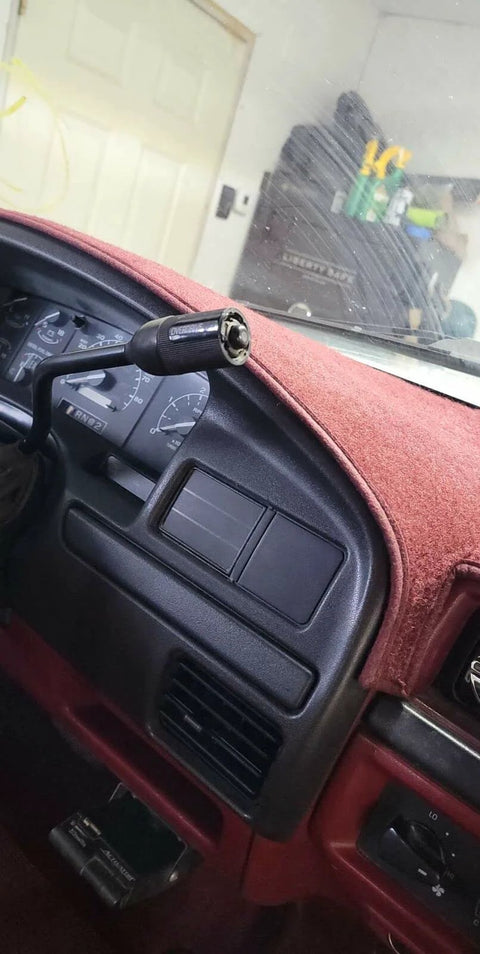 Instrument dash panel bezel installed in a red Ford interior; front gauge cluster view.