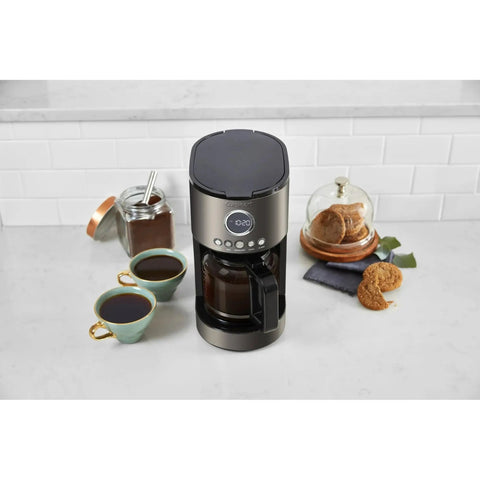 12 Cup Coffee Maker With Glass Carafe, Auto Start 24 Hour Programmable, Drip Free Pour, Black Stainless Finish on kitchen counter