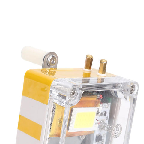 Close-up of Hand Crank Portable Power Generator for emergency USB charging with built-in light and battery storage.