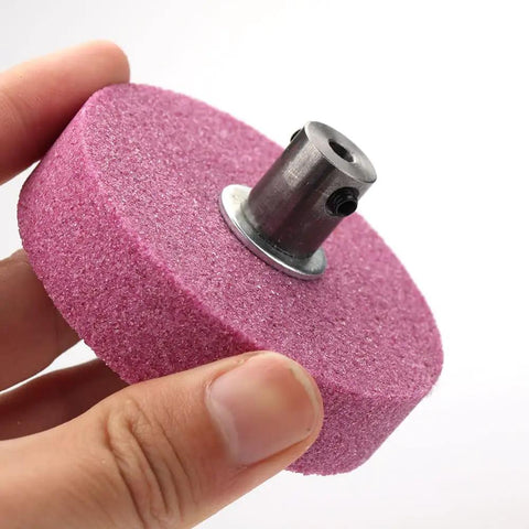 Top Shelf 3 Inch Bench Grinding Wheel And Polishing Disc For Knife Sharpener Drill Bit Grinder showing pink grinding stone with metal shaft.