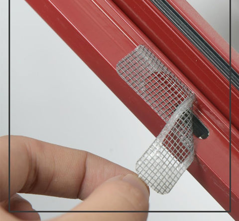 Applying 60 Pcs Window Screen Repair Patches Kit With Heavy Duty Adhesive Mesh Tape on red window frame for tear repair