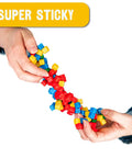 125 Pack Mini Sticky Stacking Cubes Four Color Set For STEM Hands On Building And Creative 3D Art Projects Kid Friendly Classroom And Home Decor Toy Blocks For Learning Fun. hands holding 1cm polymer cubes, super sticky