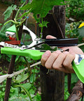 Hands using Plant Tying Gun For Grapes Raspberries Tomatoes Vining Vegetables With 10000 Staples And 20 Rolls Tape Plus Replacement Blade Upgraded Garden Tape Tool in garden