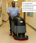 Person using Self Propelled 22 Inch Walk Behind Floor Scrubber Dryer With Forward And Reverse Drive in hallway