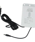 Reliable Mini Ups With 6000 Mah Battery Backup For Wifi Routers Modems And Security Cameras 12 Volt 2 Amp Power Supply showing black cable and white adapter.