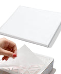50 Pack Nail Dust Collector Filter Paper Pads For Nail Pros Lightweight PP Material shown stacked and in use