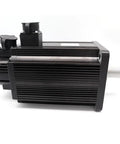 Side view of AC servo motor with ribbed black aluminum housing, right-side shaft and top-mounted drive block.