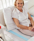 Legit Super Absorbent 23 X 36 Inch Disposable Underpads For Adults Incontinence And Seniors Straight Up Leak Proof Overnight Bed Pads Heavy Duty Pee Pads For Multi Purpose Mattress Protection 40 Count on bed with smiling elderly woman.
