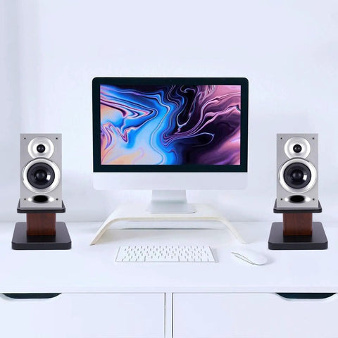Pair Of Universal Wood Design Speaker Stands For Bookshelf Speakers And Studio Monitors, Level Up Your Home Theater Audio With 6 Inch Height In Yellow Sandalwood Finish, Stable MDF Construction For Premium Surround Sound positioned on a desk with computer setup