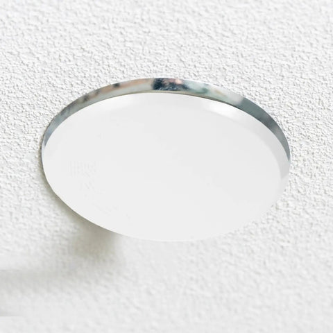 Slick White Iron Fire Sprinkler Covers 2 Pack Discreet Ceiling Plates on textured ceiling, 3.34 inch round white iron finish.