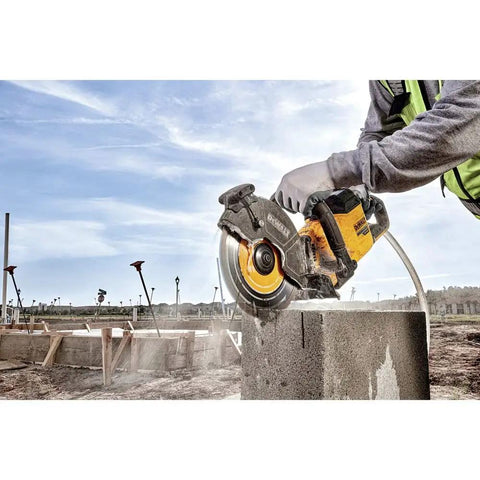 Flexvolt 9 Inch Diamond Cutting Wheel For Masonry And Concrete With Seven Eighths Inch Arbor 6600 Max RPM in use cutting block