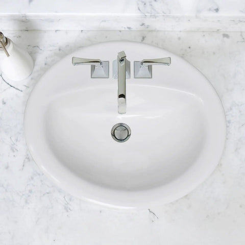 Top Shelf White Ceramic Drop In Bathroom Sink 20 Inch Single Bowl Vanity Washbasin Self Rimming with faucet on marble countertop.