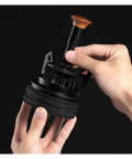 Smooth Operator Espresso Rotary WDT Tool And Coffee Stirrer With Built In Dosing Funnel Stand For Even Powder Distribution and knockout barista shots at 54mm, held in hand.