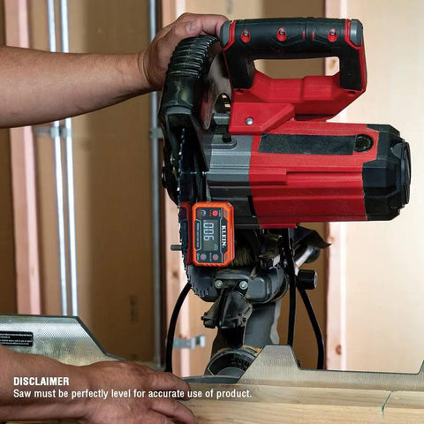 Digital Level And Angle Gauge With LED Alert And Angle Setter measuring angle on red power tool in workshop