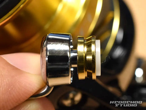 Close-up of Nexave Fi Line Roller Bearing Upgrade Kit for 21 Nexave Fishing Reels showing metal and gold roller components.