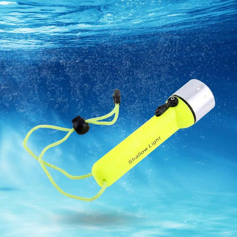 Underwater Dive Light 180LM LED Flashlight For Scuba, Snorkeling, And Outdoor Adventures floating in water with yellow aluminum body