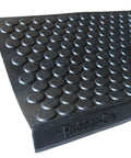 Close-up of Coin Grip Grippy Non Slip Rubber Tread Stair Mats 6 Pack Black with raised coin pattern for slip resistance