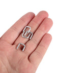 Bulk 4000 Piece Aluminum U Shaped Sausage Casing Clips And Nail Clippers For Rapid Batch Production Fast Changeover Tools held in hand.