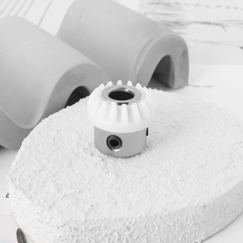 Two Piece Sewing Machine Vertical Top Shaft Bevel Gear Replacement Kit 155819 for Singer 247-478 on white surface