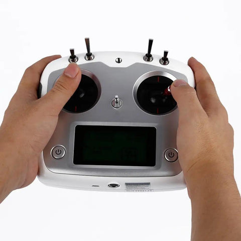 Hands holding Left Hand Throttle 2.4G RC Transmitter With AFHDS 2A 10 Channel Control, full touchscreen visible.