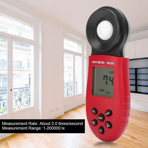 Lux Meter Handheld Light Meter For Indoor Lighting Plants Photography And Home Office Use Accurate Illuminance Tester In Lux And Foot Candles Portable Battery Powered Easy To Use On The Go Budget Friendly. Red ABS HS1010 handheld light meter in a bright room, showing 74 lux.