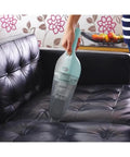 Cordless Handheld Vacuum For Cars And Home Fast Clean, 2Ah Battery, Icy Blue in use on a black leather sofa