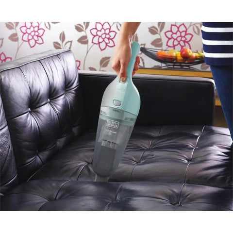 Cordless Handheld Vacuum For Cars And Home Fast Clean, 2Ah Battery, Icy Blue in use on a black leather sofa