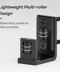 Adjustable Sliding Barn Door Floor Guide With Smooth Glide Rollers For No Sweat Wall Mounted Setup In Black Bulletproof Heavy Duty Aluminum Hardware Kit, close-up of multi-roller design.