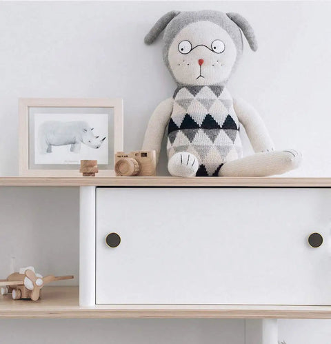 Shelf with toy animal doll and 10 Pack Brass Round Cabinet Knobs One And One Quarter Inch Diameter Gold Drawer Pulls installed on drawers