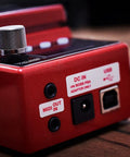 Close-up of RC-5 Loop Station High Resolution 32-Bit AD/DA and 32-Bit Float Processing Looper ports and controls on wood surface.