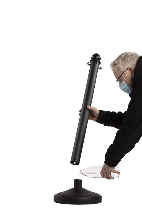 Person assembling Yellow Plastic Stanchions 2.5 Inch Diameter 40 Inch Height 6 Pack Crowd Control Barriers With Fillable Flat Bases And Poles