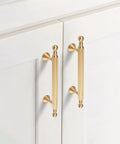 Two Pack Solid Brass Cabinet Handles In Gold Finish, 6.22 Inch Length, installed on white cabinet doors