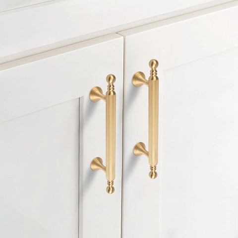 Two Pack Solid Brass Cabinet Handles In Gold Finish, 6.22 Inch Length, installed on white cabinet doors
