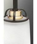 Detail of West Village Bath And Vanity Light Fixture in Antique Bronze, Modern Industrial Style with prismatic glass shade