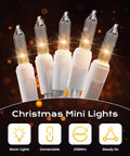 Clear Incandescent Mini Christmas Lights 100-Count On 20 Ft White Wire End-To-End Connectable 2.4 Inch Bulbs close-up