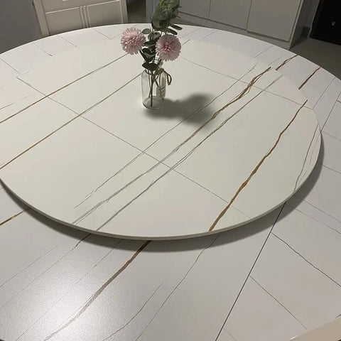 Marble Lazy Susan 360-Degree Rotating Serving Plate For Party-Ready Dining Tables with a vase on top, 23-inch white marble.
