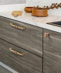 Two Pack 5 Inch Brass Cabinet Pulls Antique Floral Pattern Cupboard Handles installed on kitchen drawers with matte gold finish