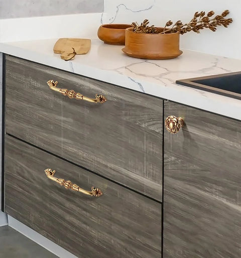Two Pack 5 Inch Brass Cabinet Pulls Antique Floral Pattern Cupboard Handles installed on kitchen drawers with matte gold finish