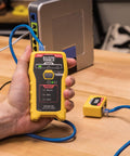 Person using RJ45 Ethernet Cable Tester And Crimper Kit With Pass Thru Technology for Cat5e and Cat6 data runs, yellow device
