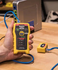 Hand holding One Button Cable Tester for RJ11 RJ12 RJ45 Voice and Data Cables with Remote LAN Explorer, testing cables