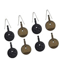 Heavy Duty Semi Metallic Bicycle Brake Pads 4 Pack Black Badass Stoppers For Mechanical Disc Rotors top view of brake pads in black and metallic colors.