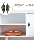 Antique Zinc Alloy Leaf Cabinet Handle Set displayed on a white cupboard, vintage style leaf drawer pulls, retro home furniture hardware