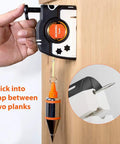 Hand using Pro Plumb Bob With Auto Retracting String 8m 26ft Nylon Cord 15oz Weight on wooden plank for leveling