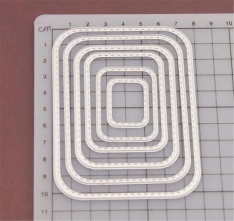 Rectangular Cutting Die Set for card making and scrapbooking on a grid, featuring 6 metal die cuts for albums and crafts.
