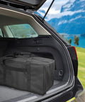 Mid-Size Weekender Travel Duffle Bag, 24x12x12 Inch, 53L Capacity, placed in the trunk of a car during a trip.