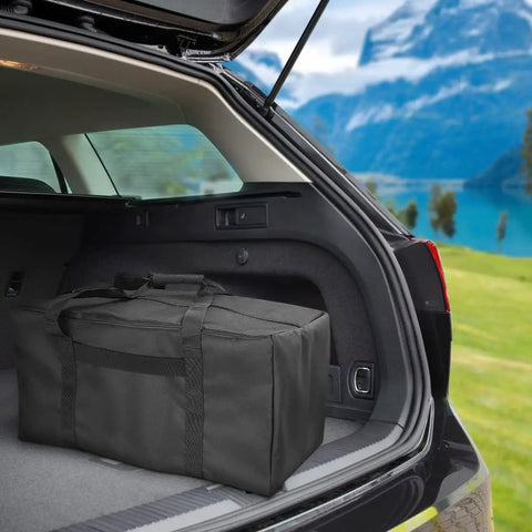 Mid-Size Weekender Travel Duffle Bag, 24x12x12 Inch, 53L Capacity, placed in the trunk of a car during a trip.